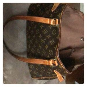 Genuine Louis Vuitton with gentle wear on edges